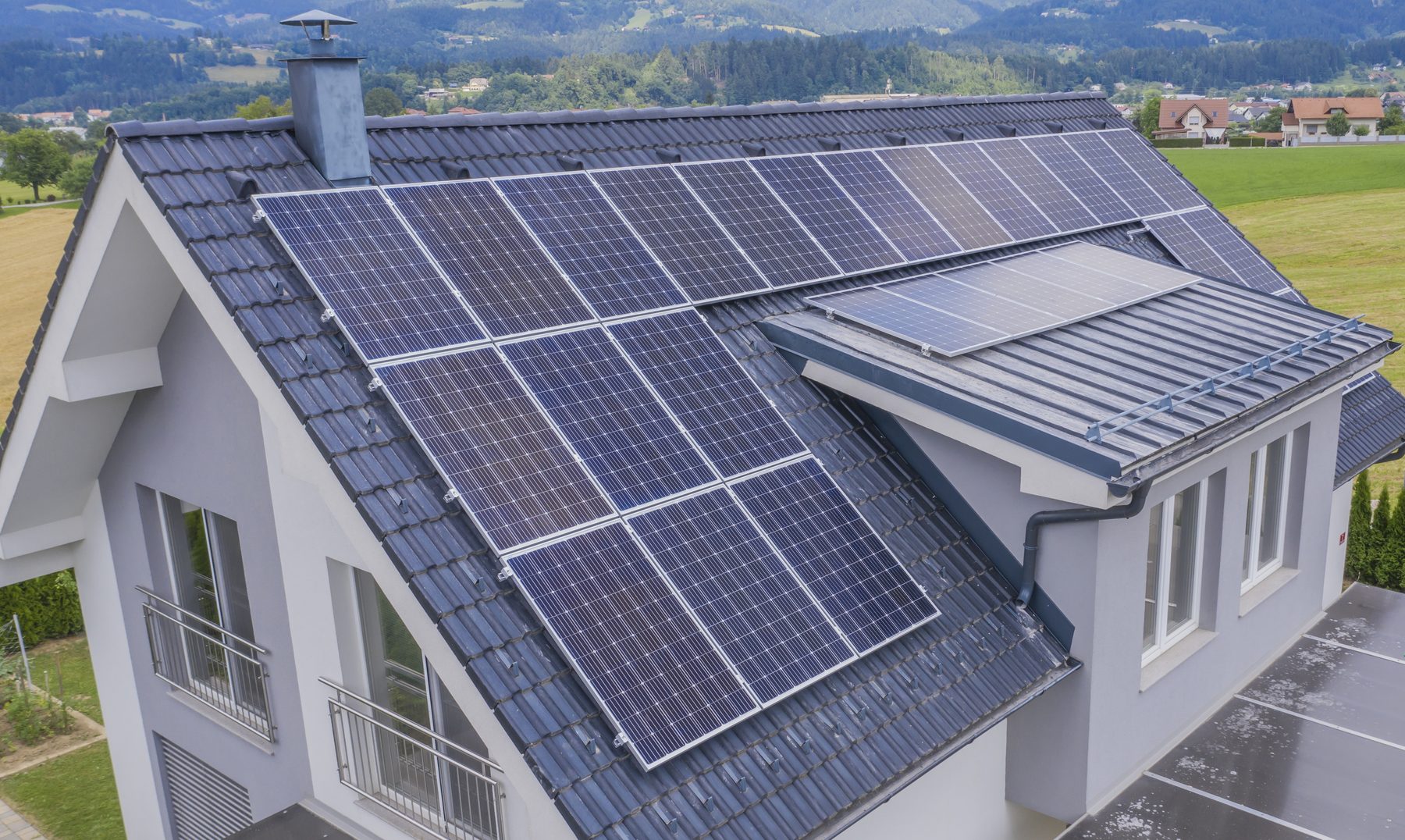 Aerial view of solar panels installed on a family house roof